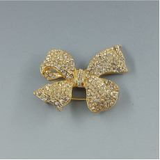 Clear Crystal and Gold Tone Bow Brooch